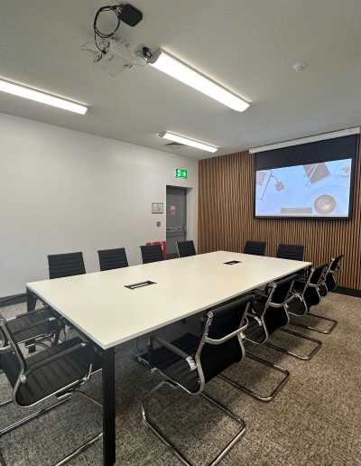 Interior seating area at The East Side Curve with comfortable chairs for visitors